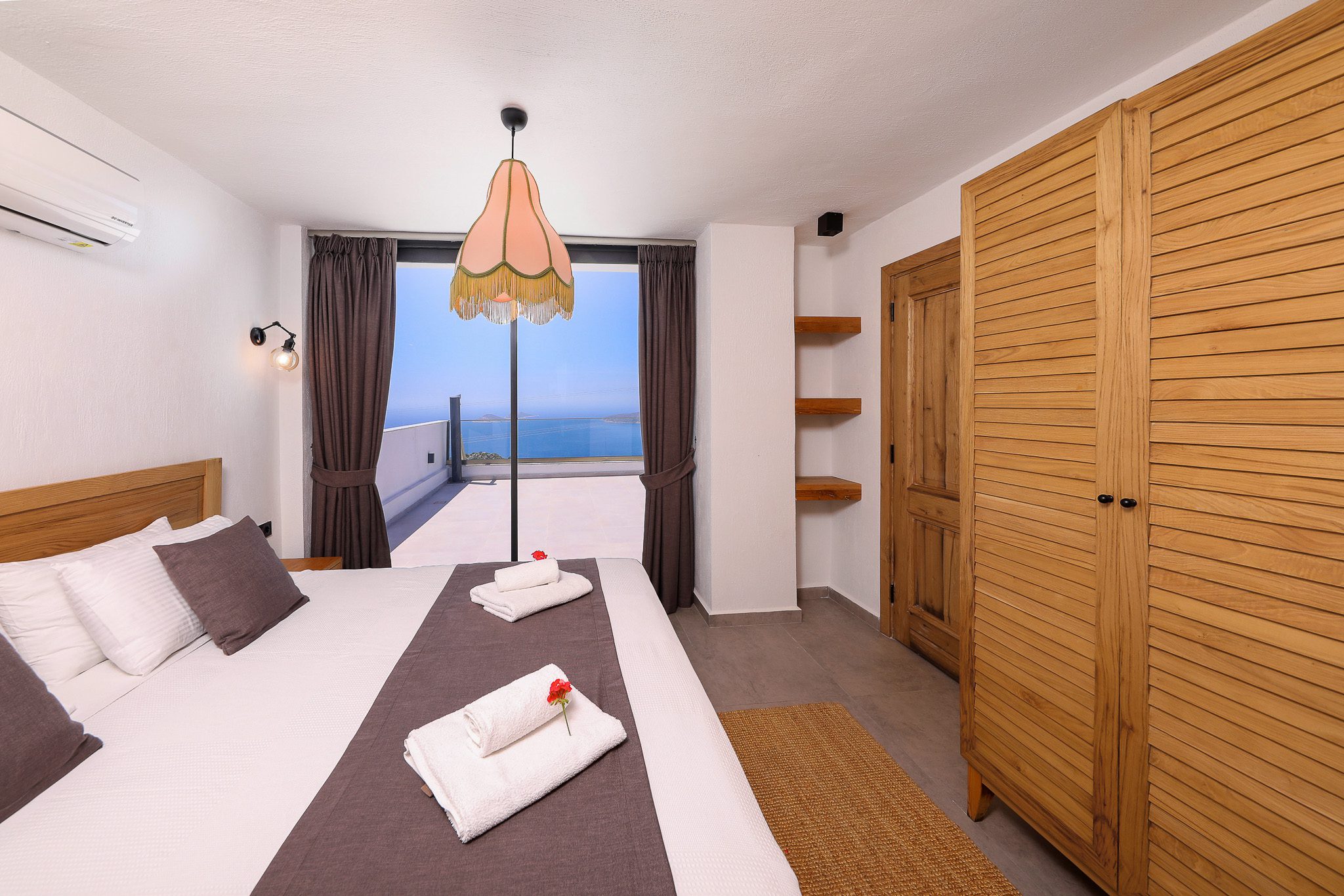 Double bedroom and bathroom with balcony entrance in Villa Rosso, villa holidays in Kalkan, Turkey