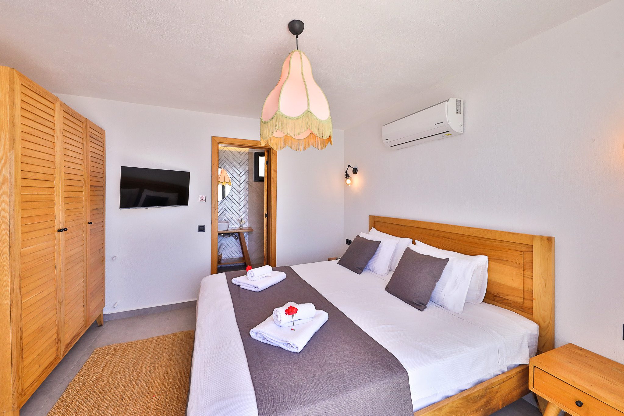 Double bedroom and bathroom in Villa Rosso, villa holidays in Kalkan, Turkey