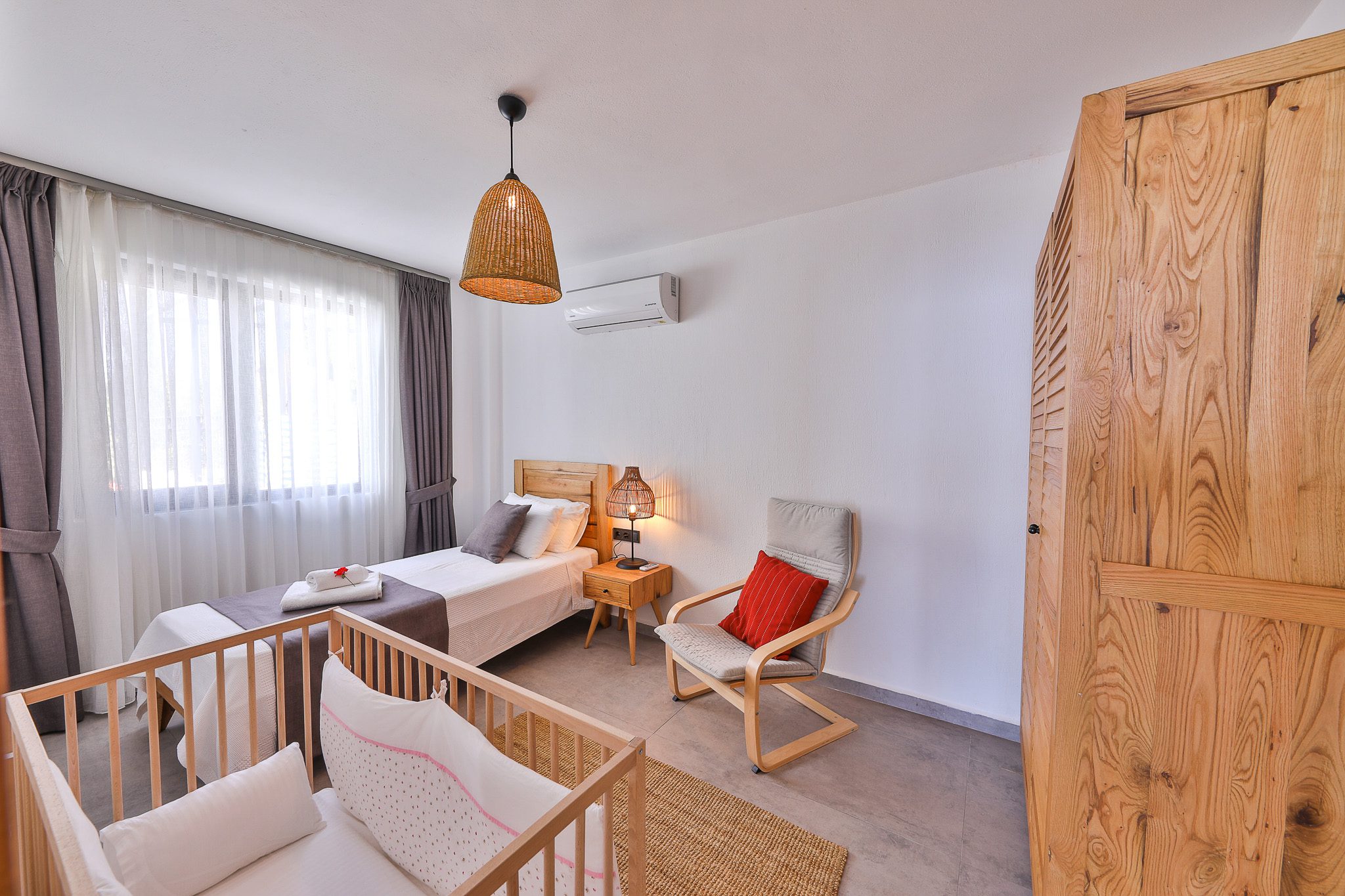 Bedroom with a cot in Villa Rosso, villa holidays in Kalkan, Turkey