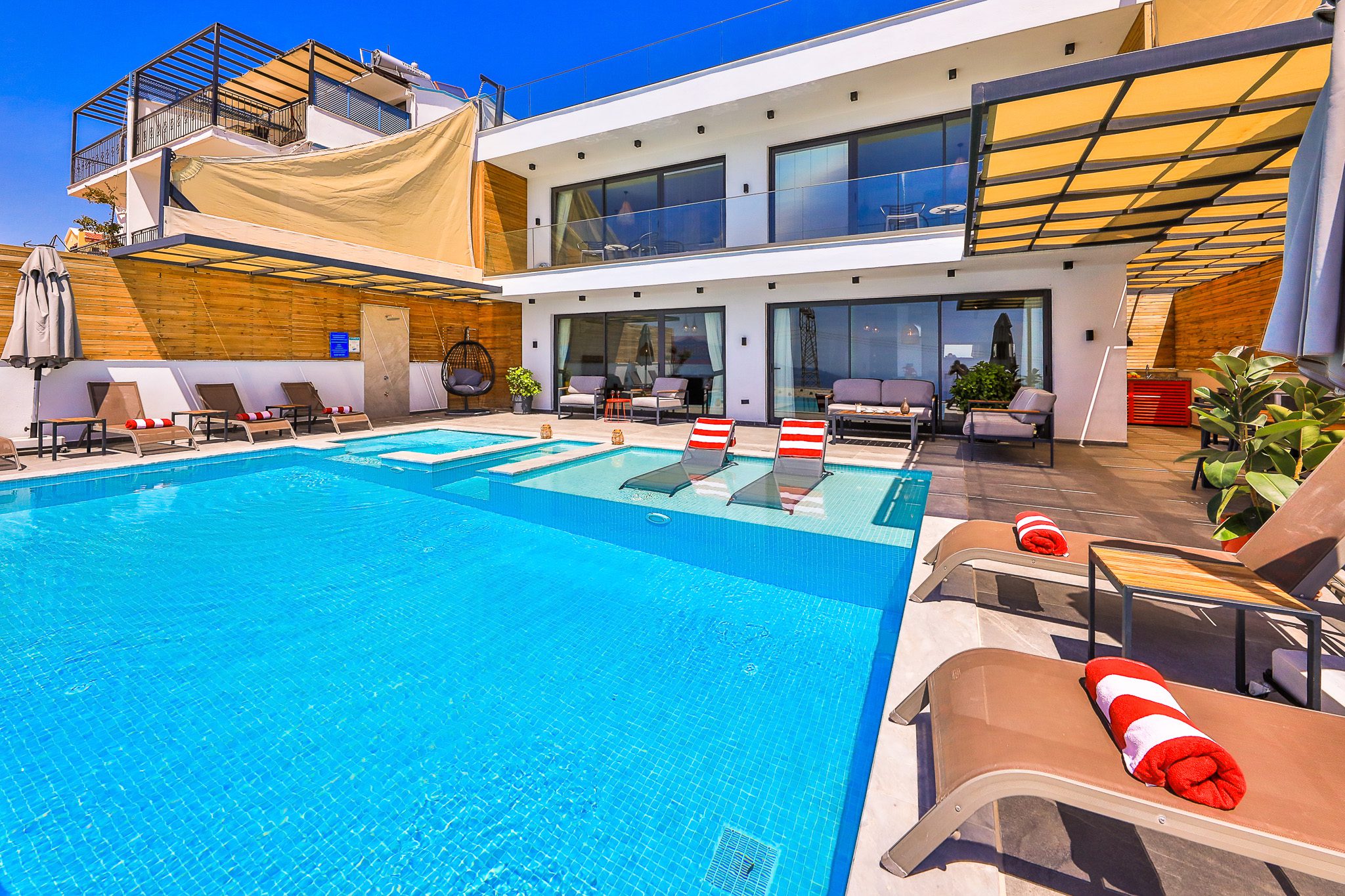 Outdoor pool and sun loungers in Villa Rosso, villa holidays in Kalkan, Turkey