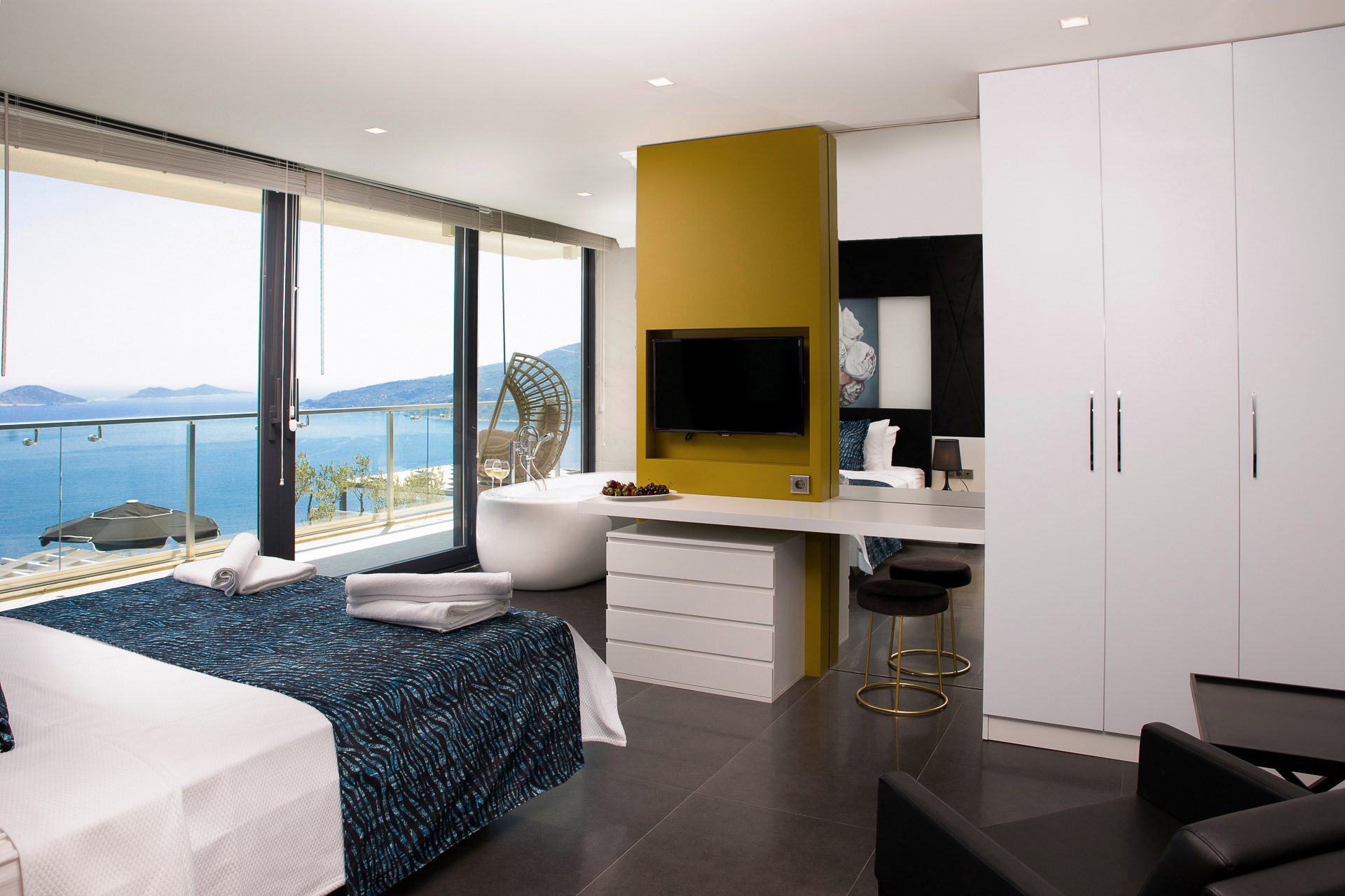 Double bedroom with bathroom and balcony of Villa Manila, luxury villa holiday in Kalkan, Turkey