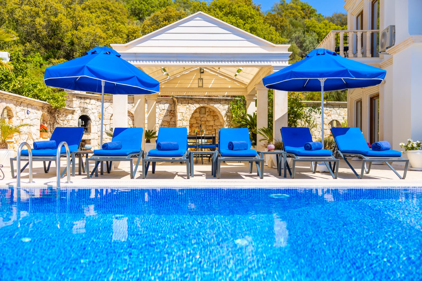 Outdoor pool and sun loungers in Villa Palmiye, villa holidays in Kalkan, Turkey