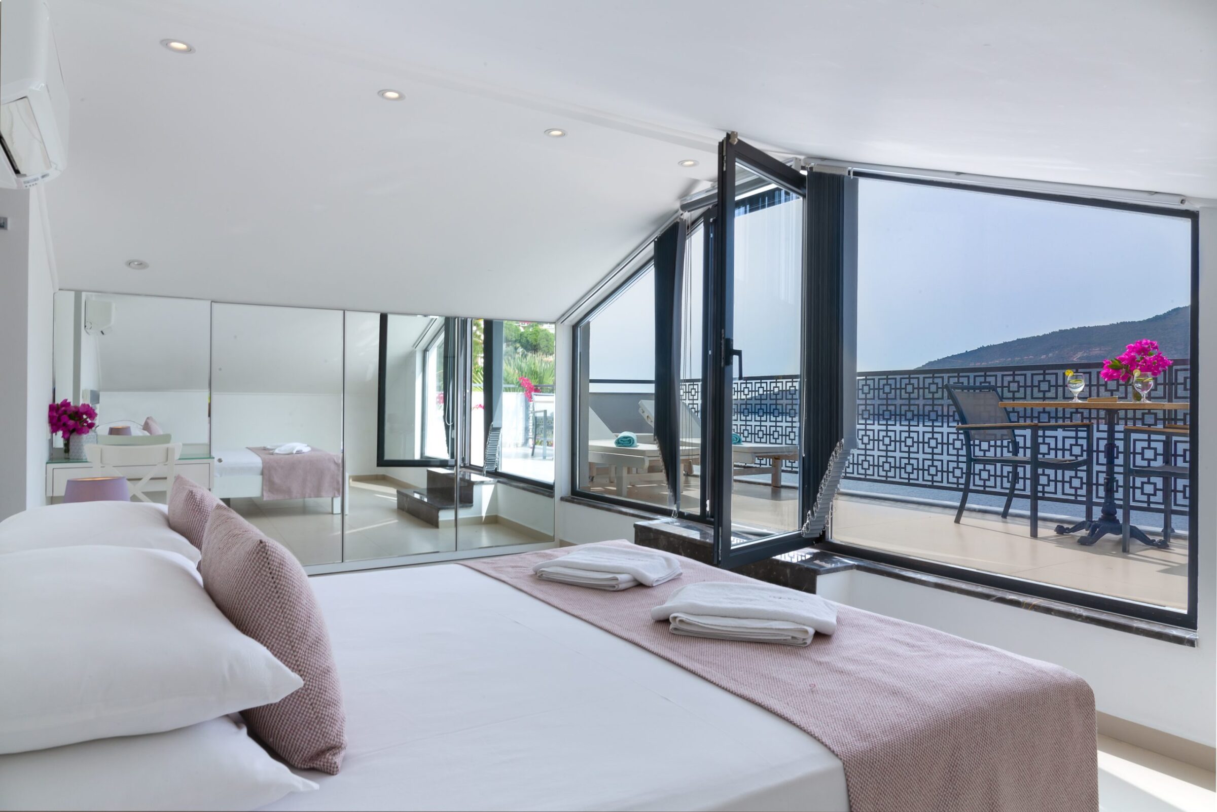 Double bedroom and balcony of luxurious Villa Nar Evi in Kalkan, Turkey