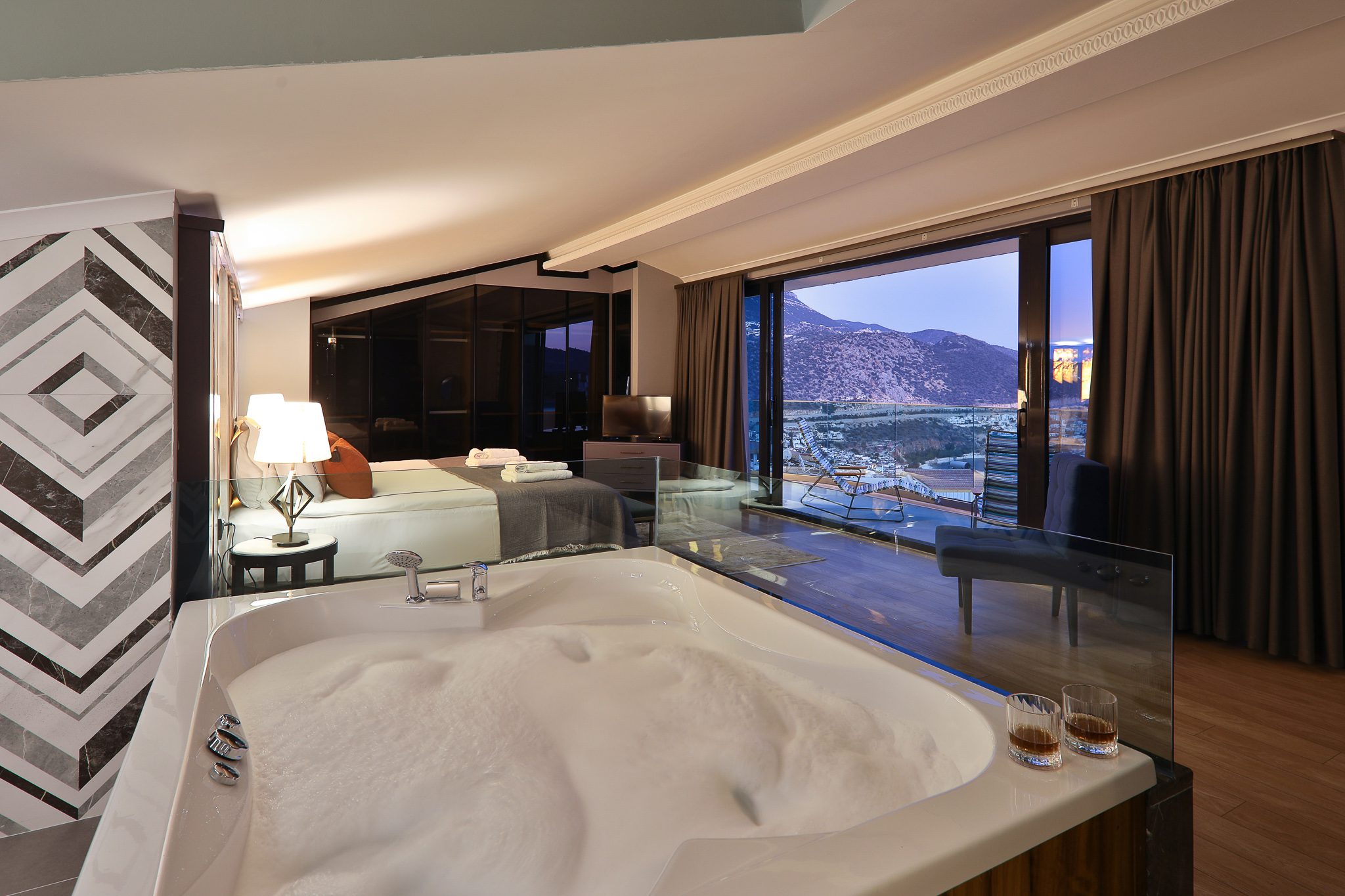 Double bedroom and bathroom with hot tub and balcony in Villa Sandie, villas to rent in Kalkan, Turkey