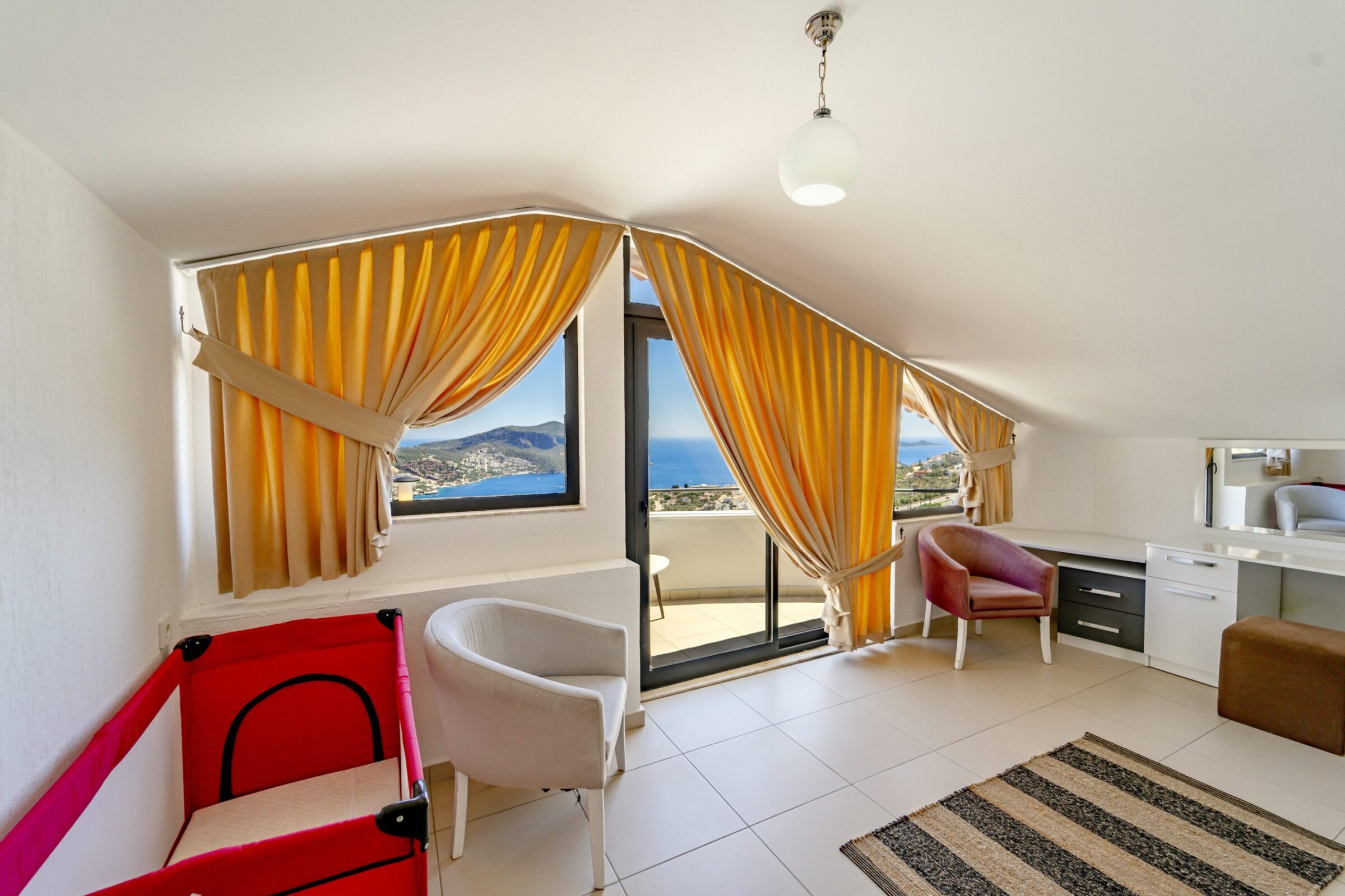 Large double bedroom with a cot and balcony in Villa Coast, villa to rent in Kalkan, Turkey