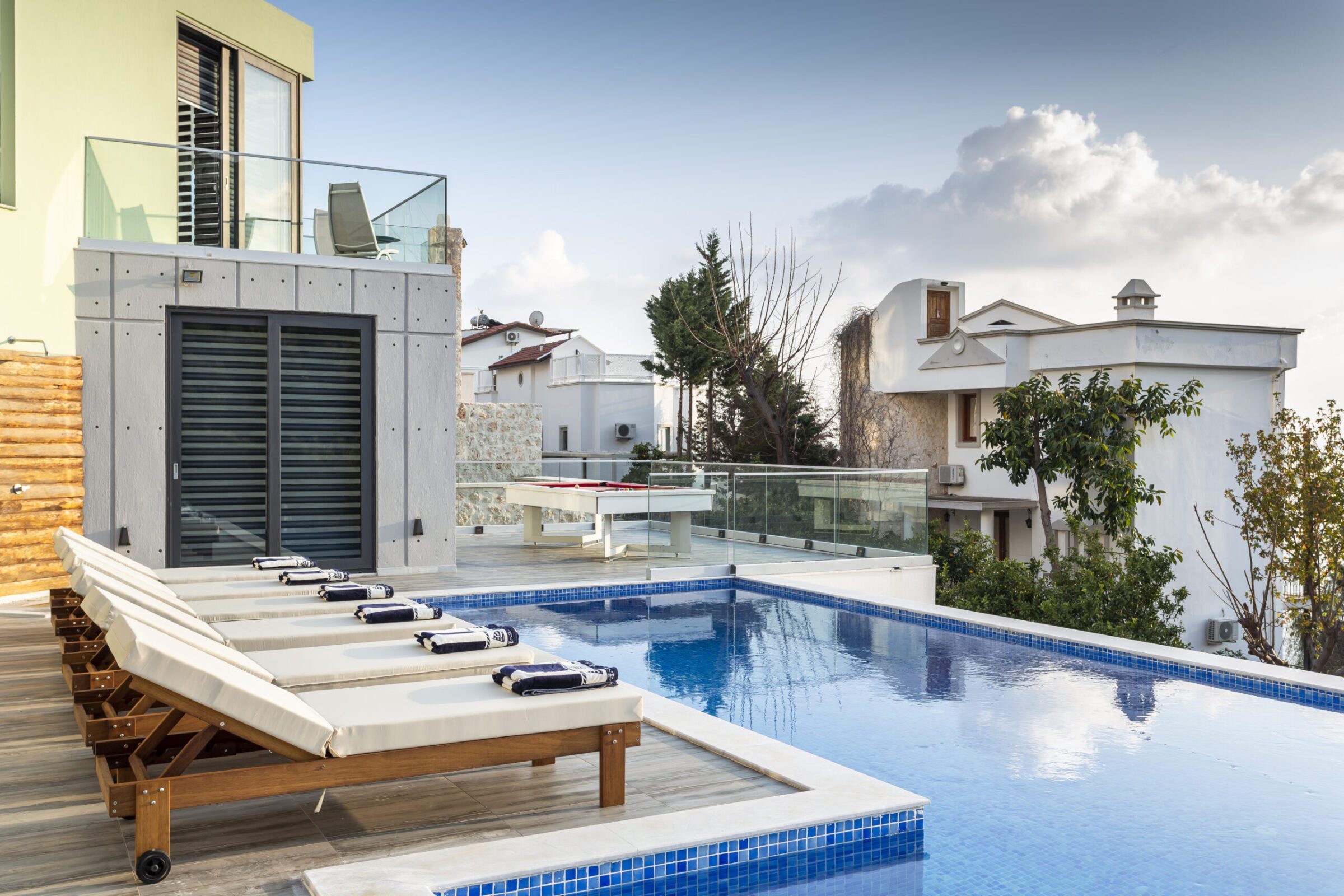 Outdoor pool and sun loungers in Villa Poyraz, villa holidays in Kalkan, Turkey
