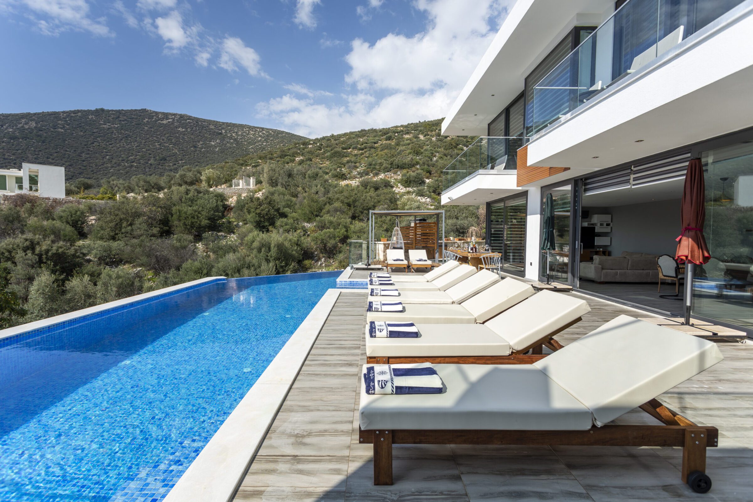 Outdoor pool with sun loungers in Villa Poyraz, villa holidays in Kalkan, Turkey
