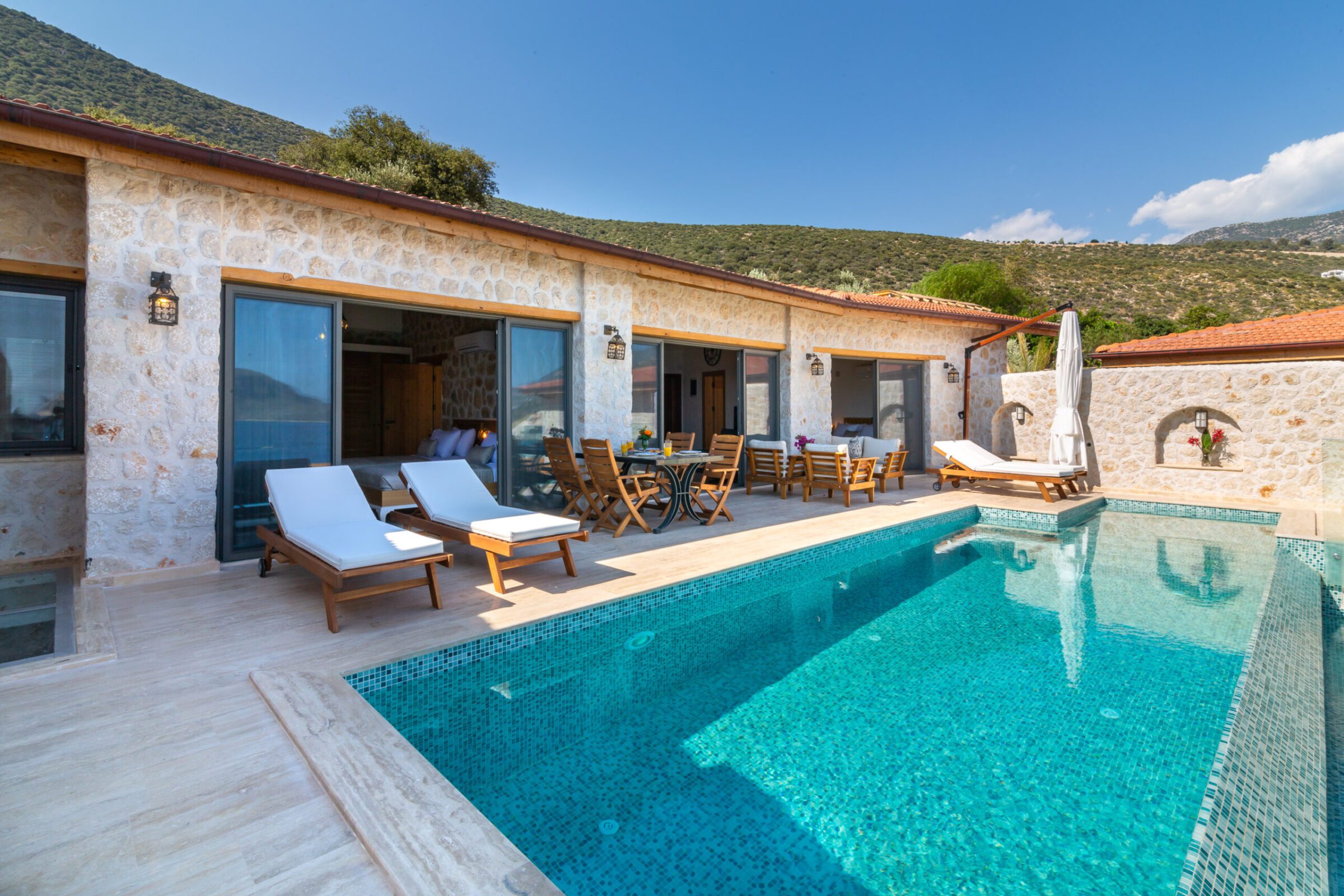 Outdoor pool and sun loungers in Villa Water's Edge 3, villa holidays in Kalkan, Turkey