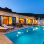 Outdoor pool with sun loungers at Villa Water Edge 3, villa holidays in Kalkan, Turkey