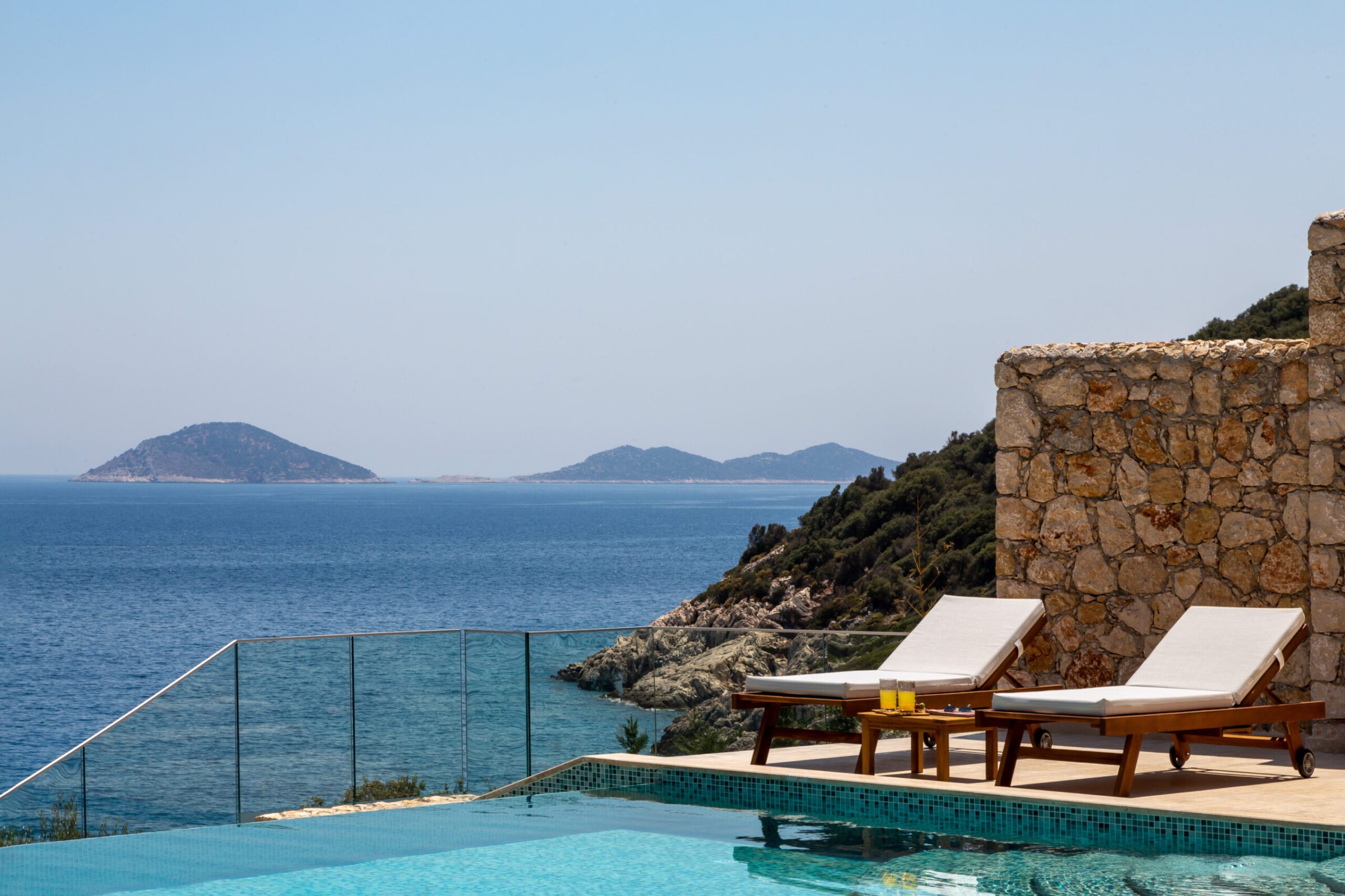 Infinity pool with sun loungers at Villa Water's Edge 2, villas to rent in Kalkan, Turkey