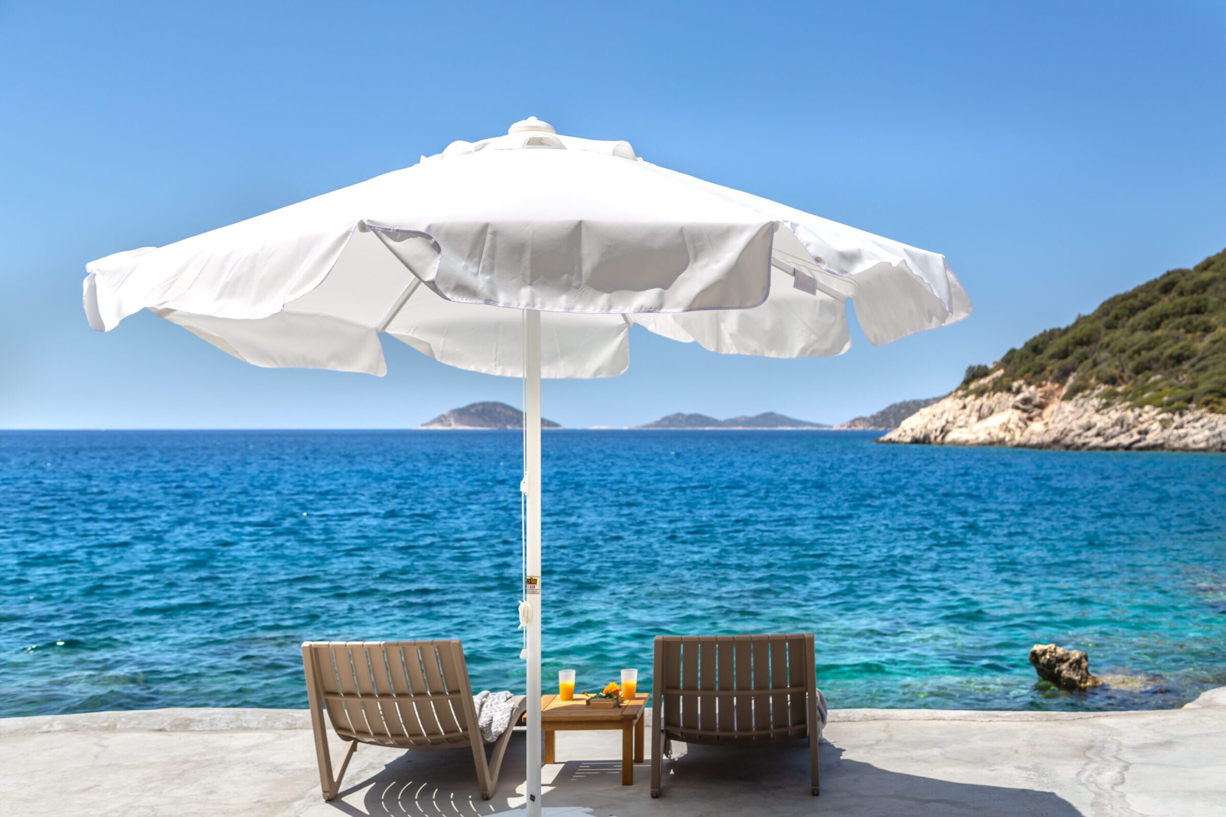 Sun loungers at beach for Villa Water Edge 6, villas to rent in Kalkan, Turkey