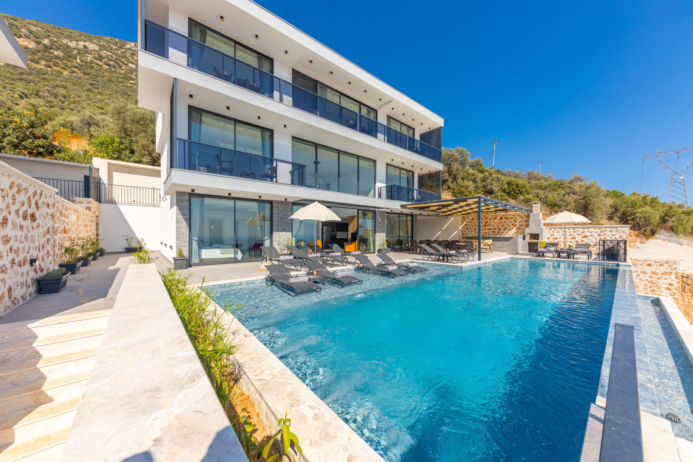 Outdoor pool with sun loungers in Villa Royal Falcon, villas to rent in Kalkan, Turkey