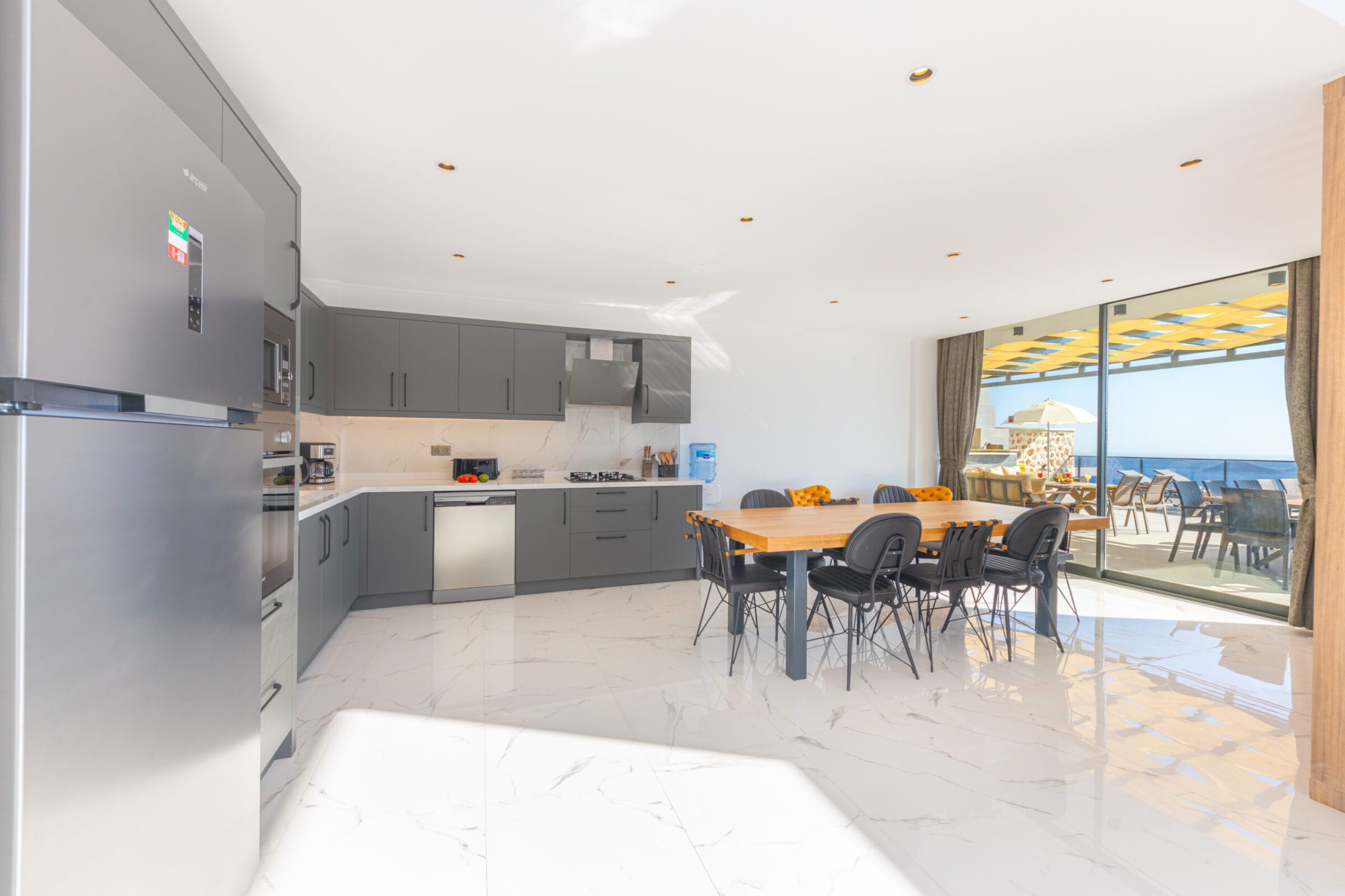 Spacious kitchen and dining table in Villa Royal Falcon, villas to rent in Kalkan, Turkey