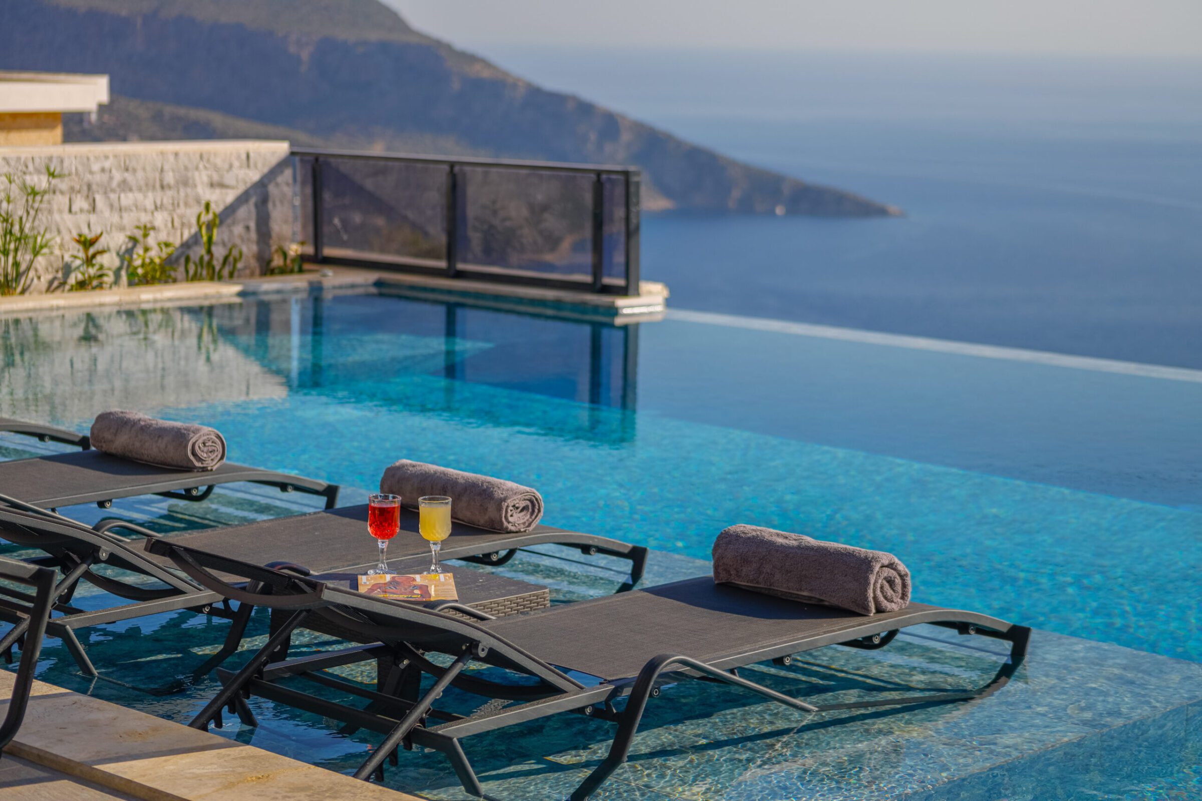 Sun loungers by pool at Villa Royal Falcon, villas to rent in Kalkan, Turkey