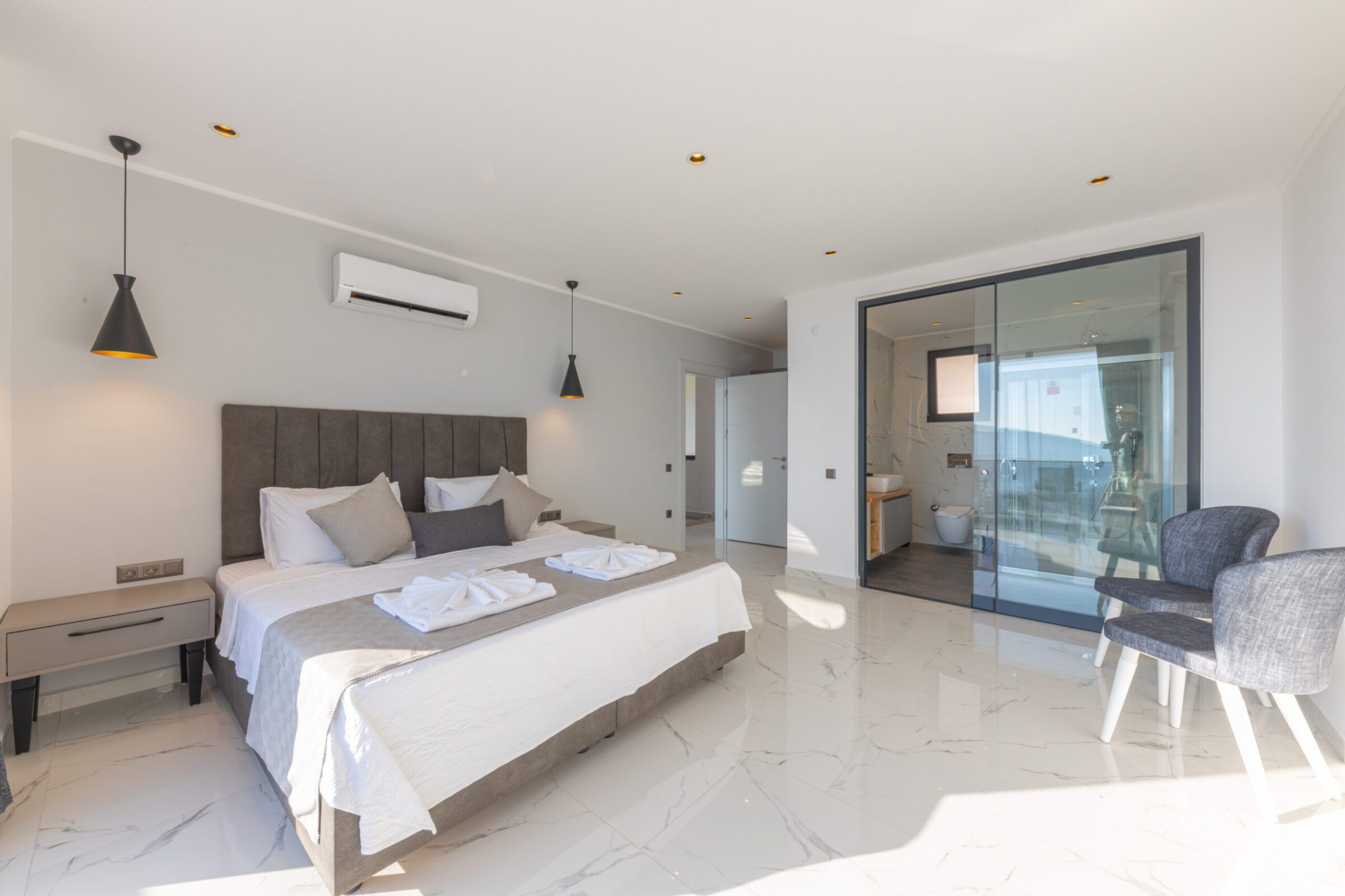 Double bedroom with bathroom and balcony access in Villa Royal Falcon, villas to rent in Kalkan, Turkey