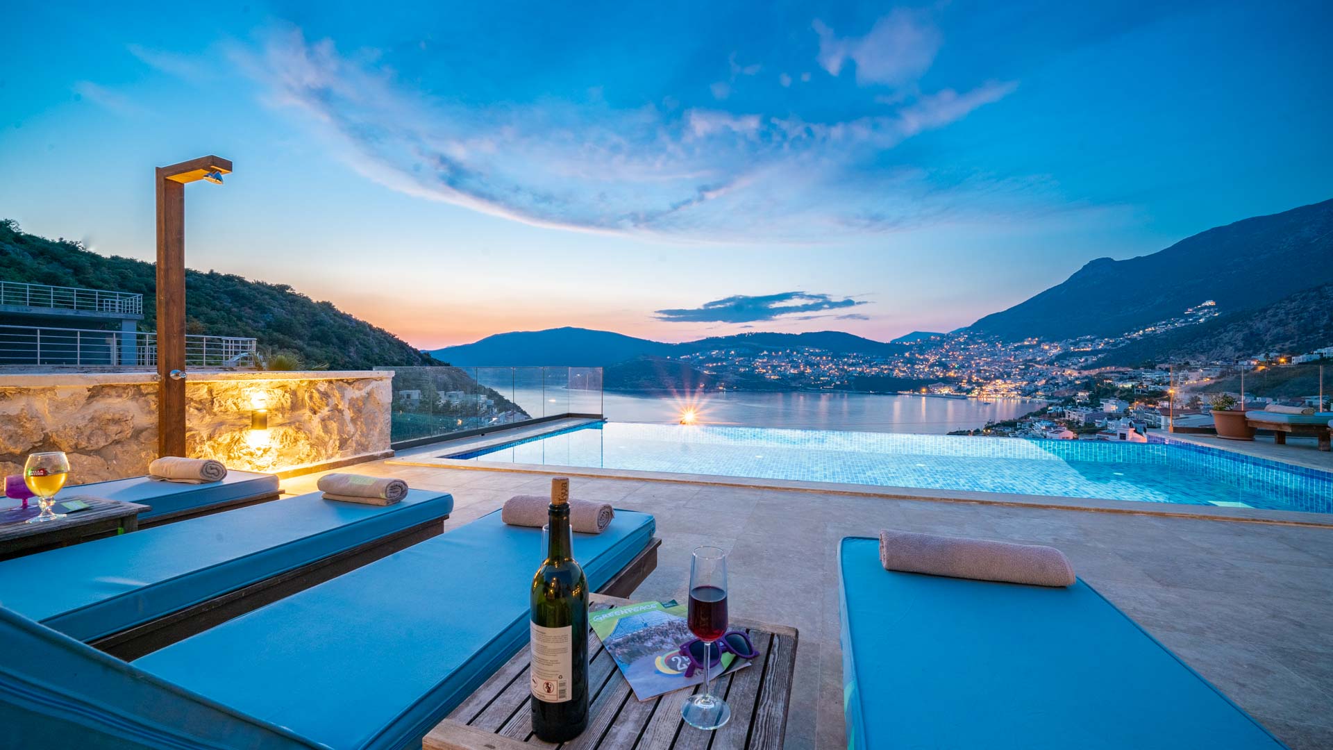 Outdoor pool and sun loungers with wine in Villa Elia, villa holidays in Kalkan, Turkey