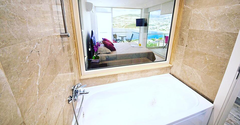 Double bedroom with bathroom in Mahumet Salvarli Suites, villa holidays in Kalkan, Turkey