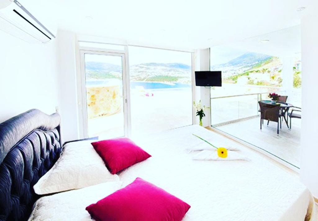 Double bedroom with balcony in Mahumet Salvarli Suites, villa holidays in Kalkan, Turkey