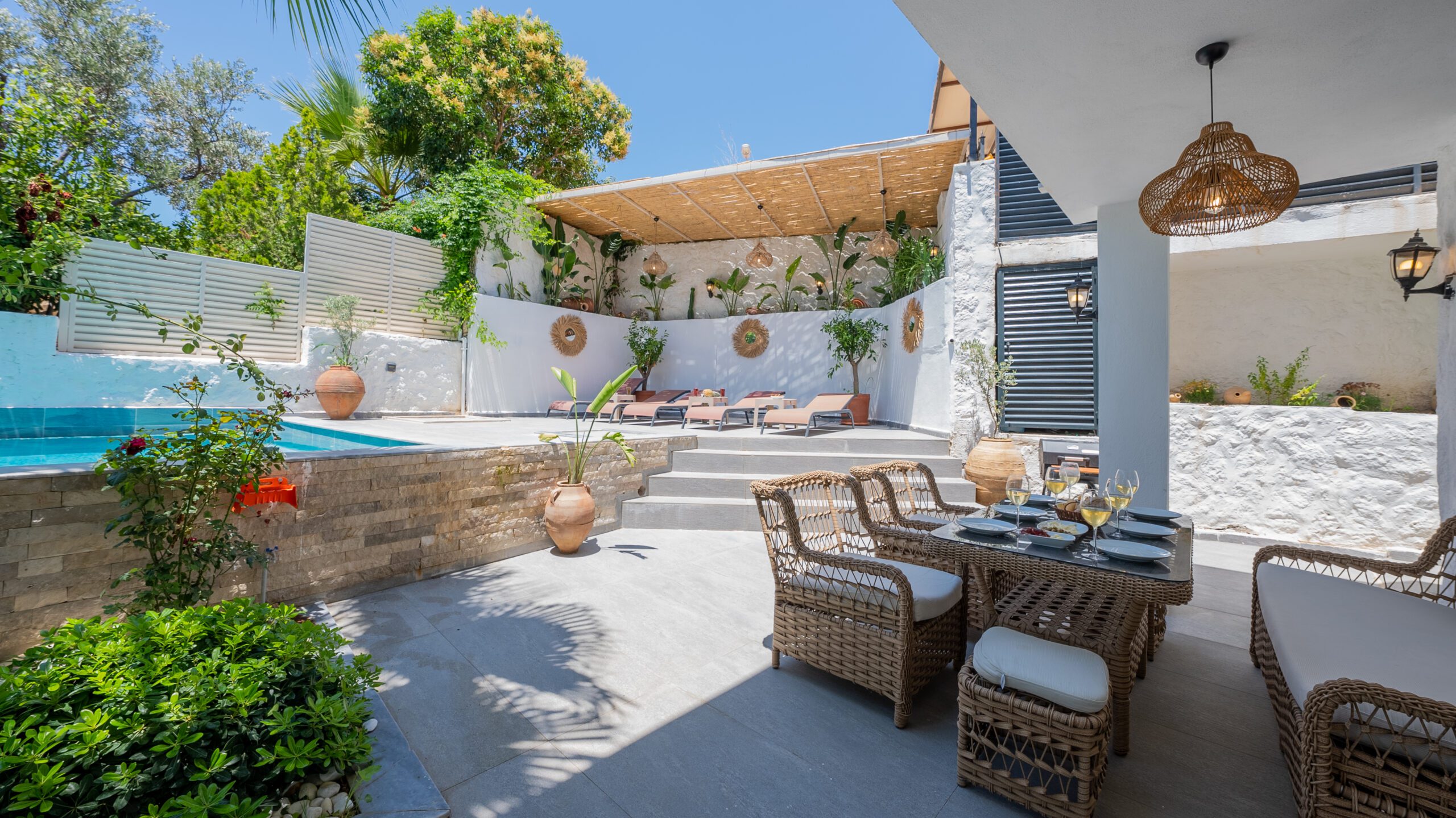 Outdoor pool, sun loungers and dining table in Villa Orange, villas to rent in Kalkan, Turkey