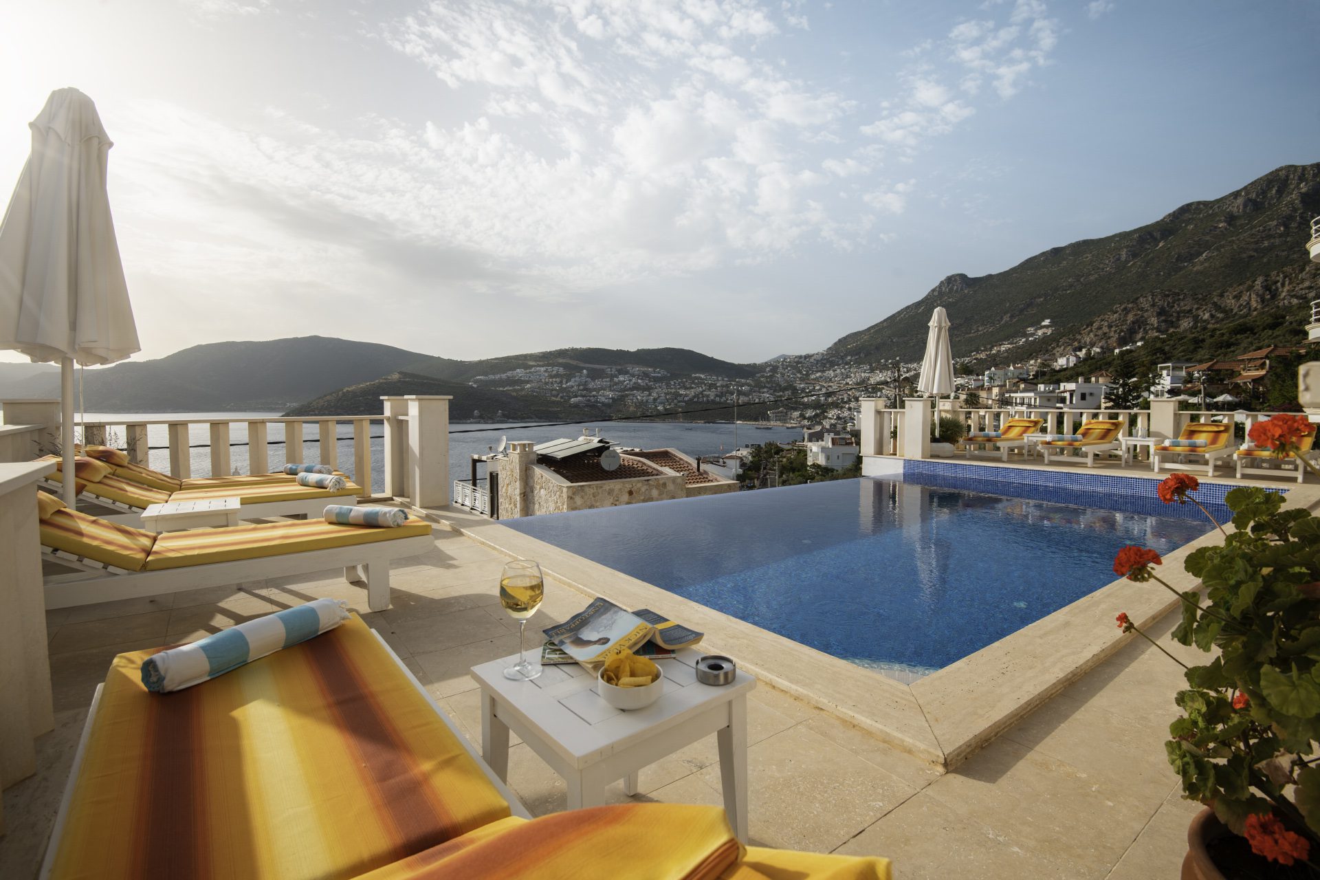 Outdoor infinity pool with sun loungers at Villa Ketchy, villas to rent in Kalkan, Turkey