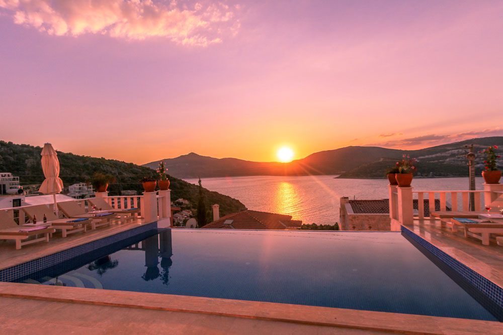 Outdoor infinity pool with sun loungers at Villa Ketchy, villas to rent in Kalkan, Turkey