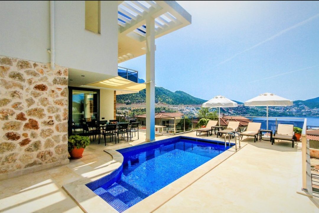 Outdoor pool and sun loungers in Zenato Apartment, villas to rent in Kalkan, Turkey