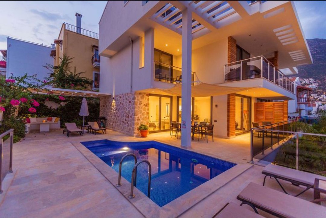 Outdoor pool and sun loungers at Zenato Apartment, villas to rent in Kalkan, Turkey