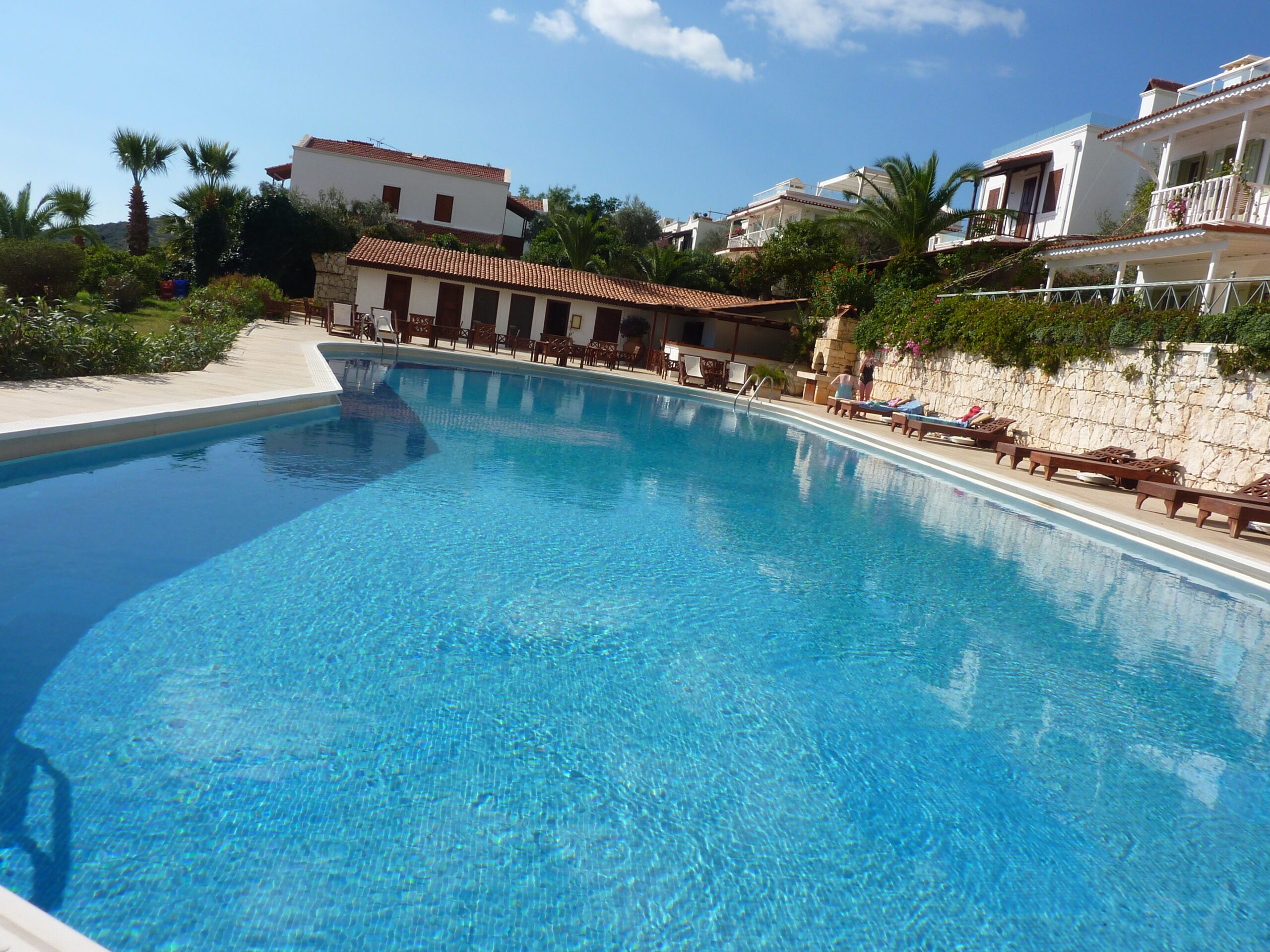 Communal outdoor pool and sun loungers at Villa Amelia, villas to rent in Kalkan, Turkey