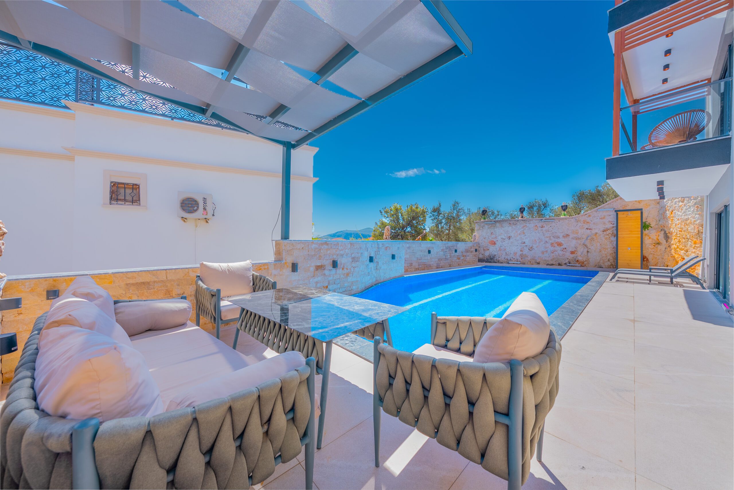 Outdoor pool and sun loungers at Villa Tekin, villa holidays in Kalkan, Turkey
