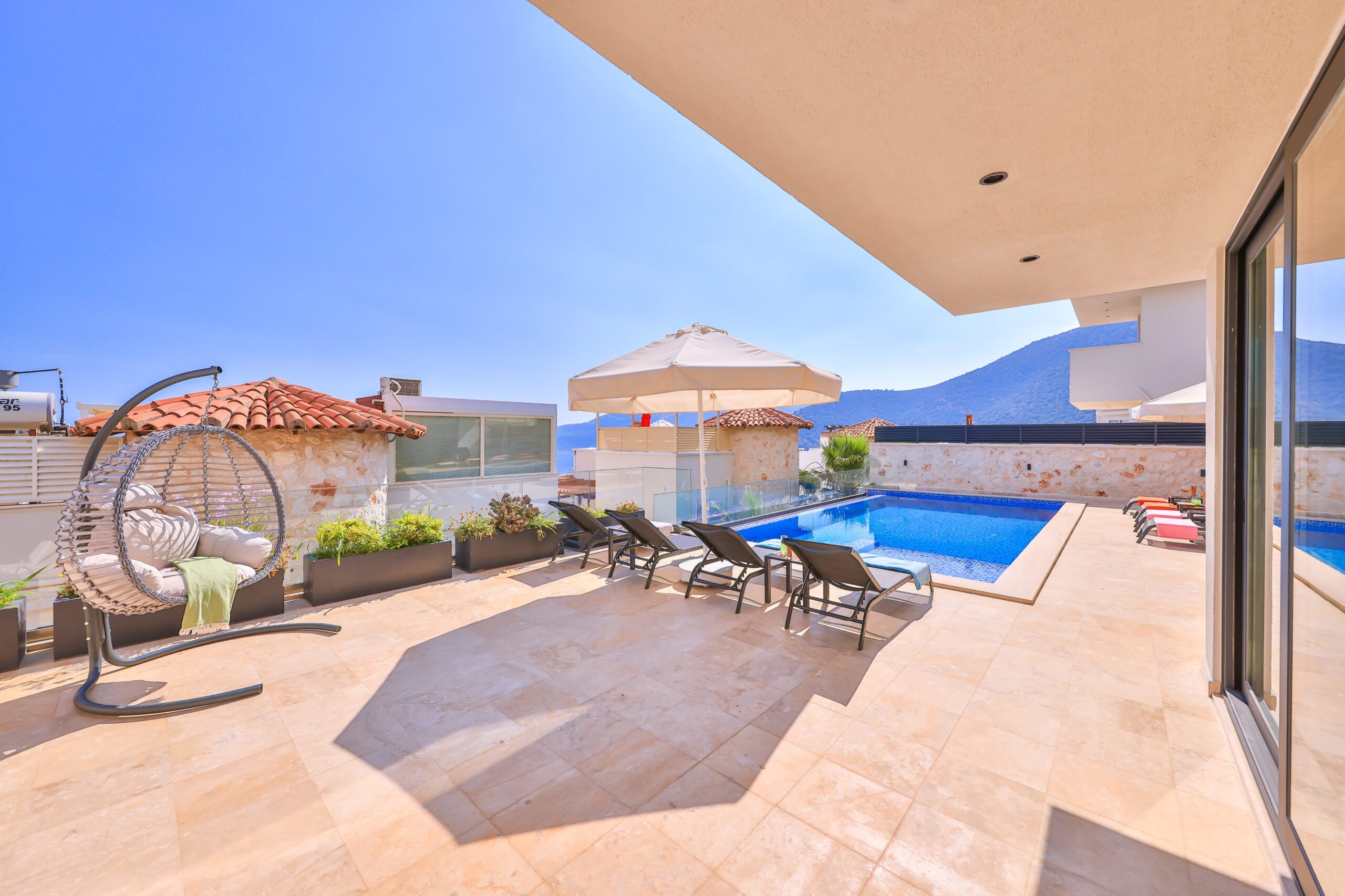 Outdoor pool and sun loungers at Villa Sura, holiday villas to rent in Kalkan, Turkey
