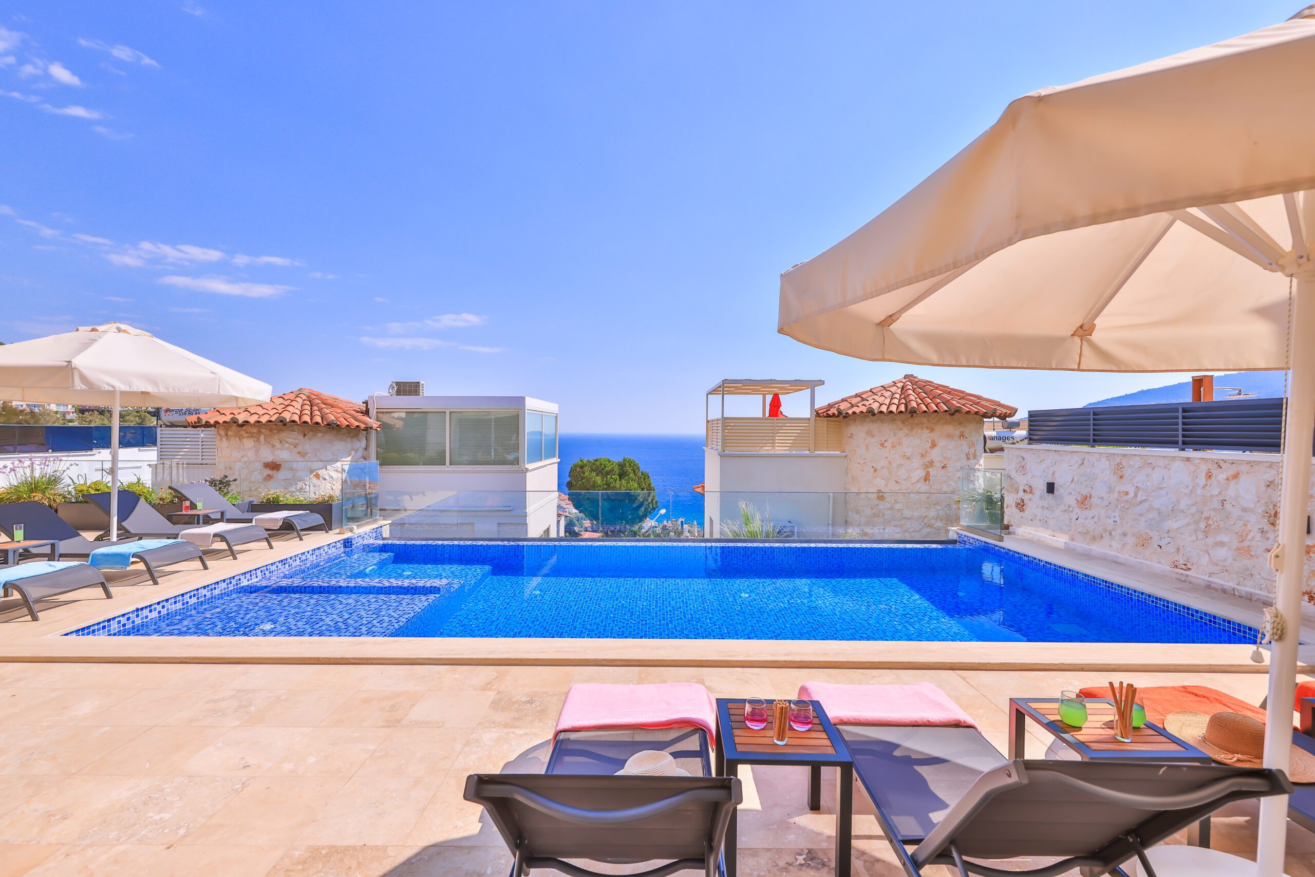 Outdoor pool and sun loungers at Villa Sura, holiday villas to rent in Kalkan, Turkey