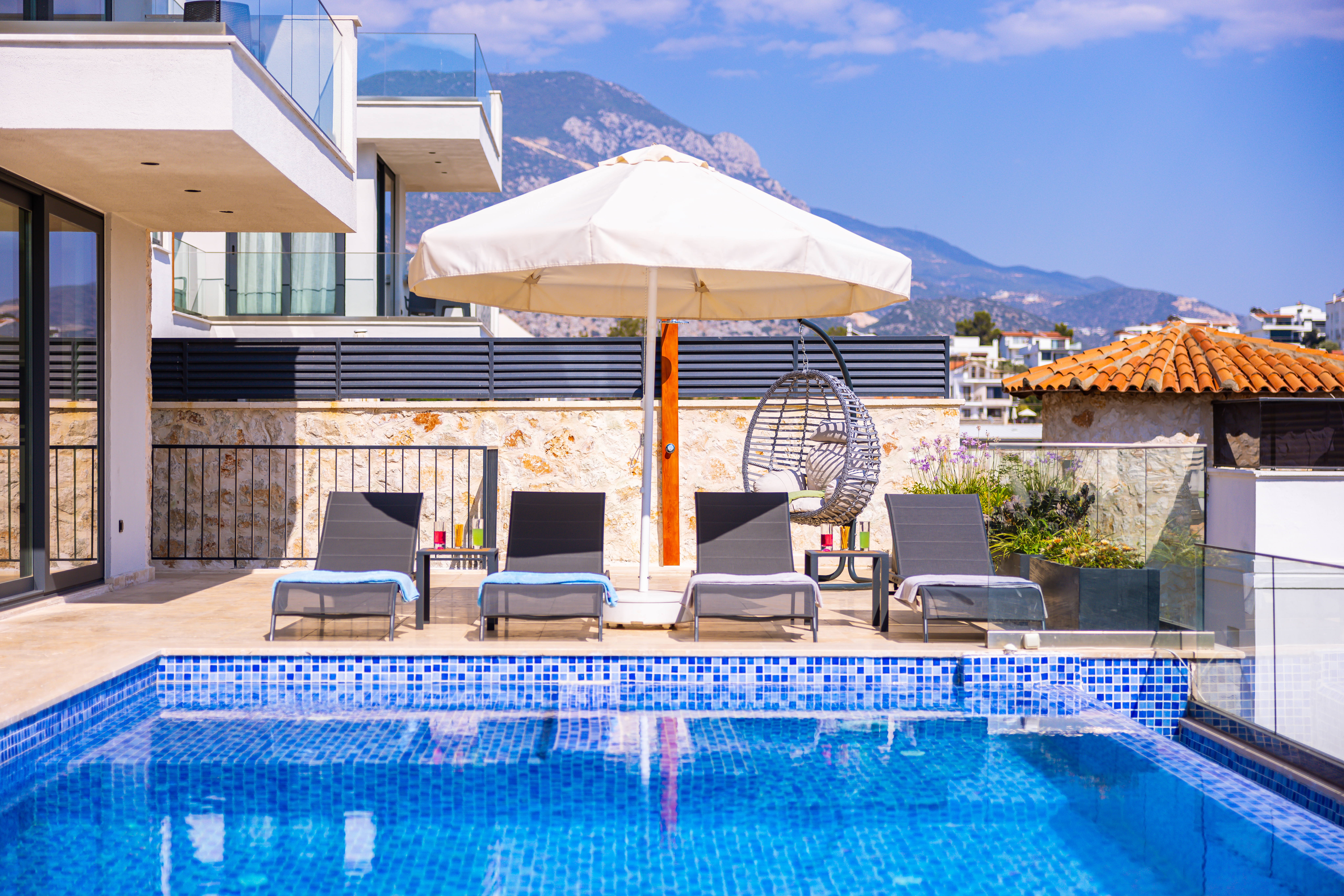 Outdoor pool and sun loungers at Villa Sura, holiday villas to rent in Kalkan, Turkey