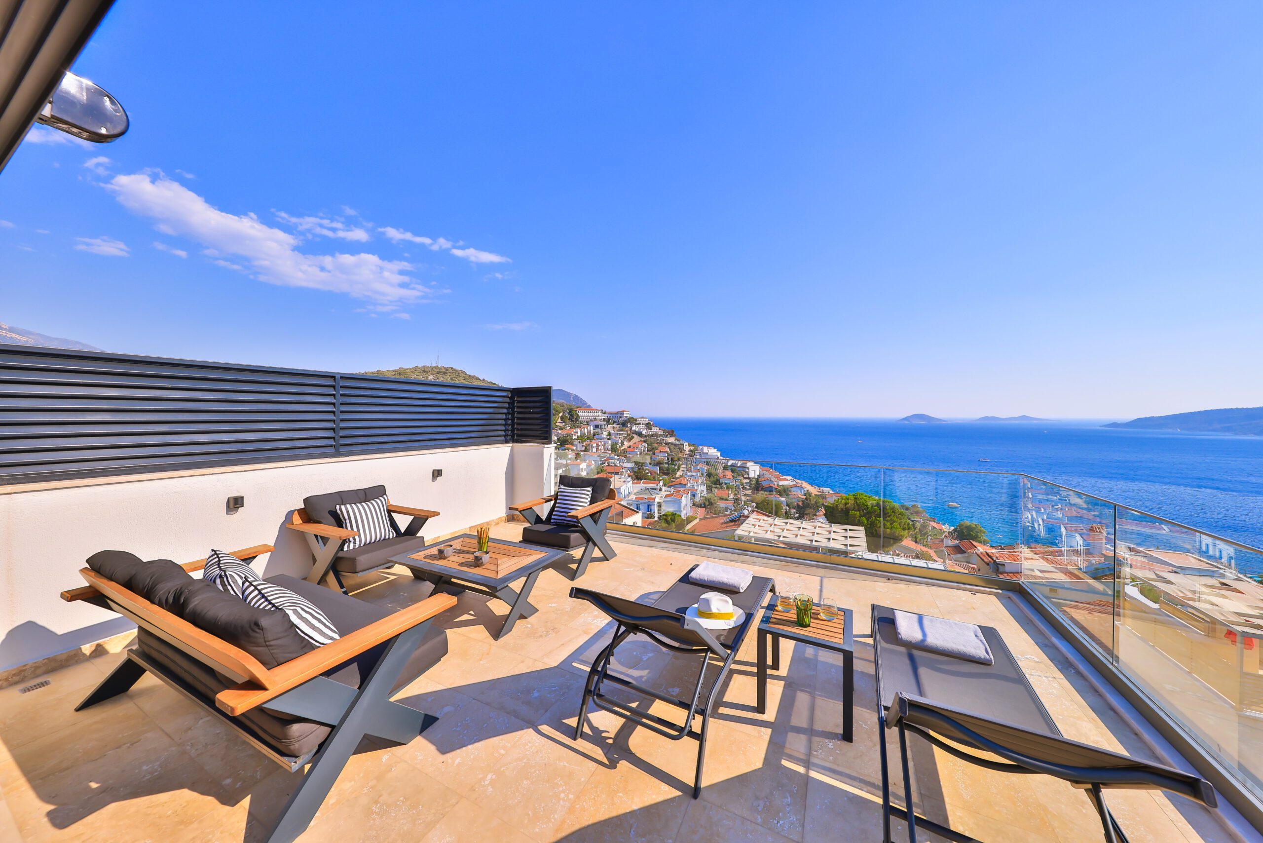 Balcony with sun loungers and seating at Villa Sura, holiday villas to rent in Kalkan, Turkey