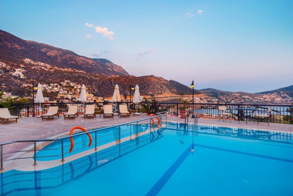 Outdoor pool and sun loungers in Amore Apartment, holidays in Kalkan, Turkey