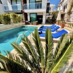 Outdoor pool with sun loungers at Villa Calypso, villa holidays in Kalkan, Turkey