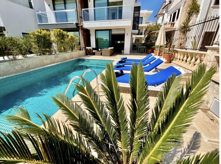 Outdoor pool with sun loungers at Villa Calypso, villa holidays in Kalkan, Turkey