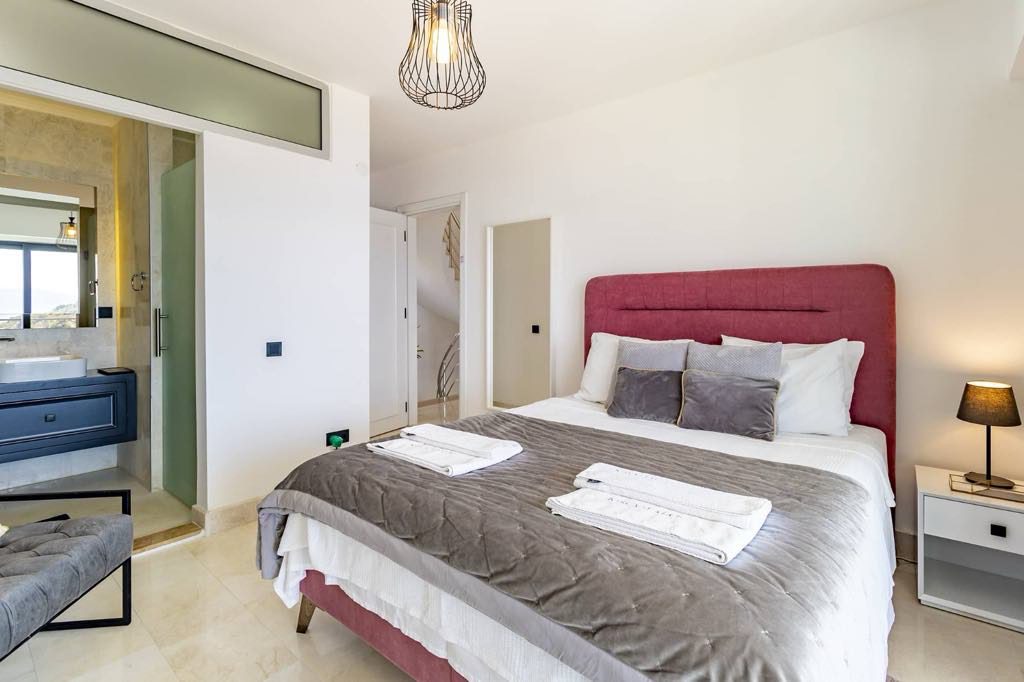 Double bedroom with bathroom and balcony in Villa Kisla Falls, villas to rent in Kalkan, Turkey