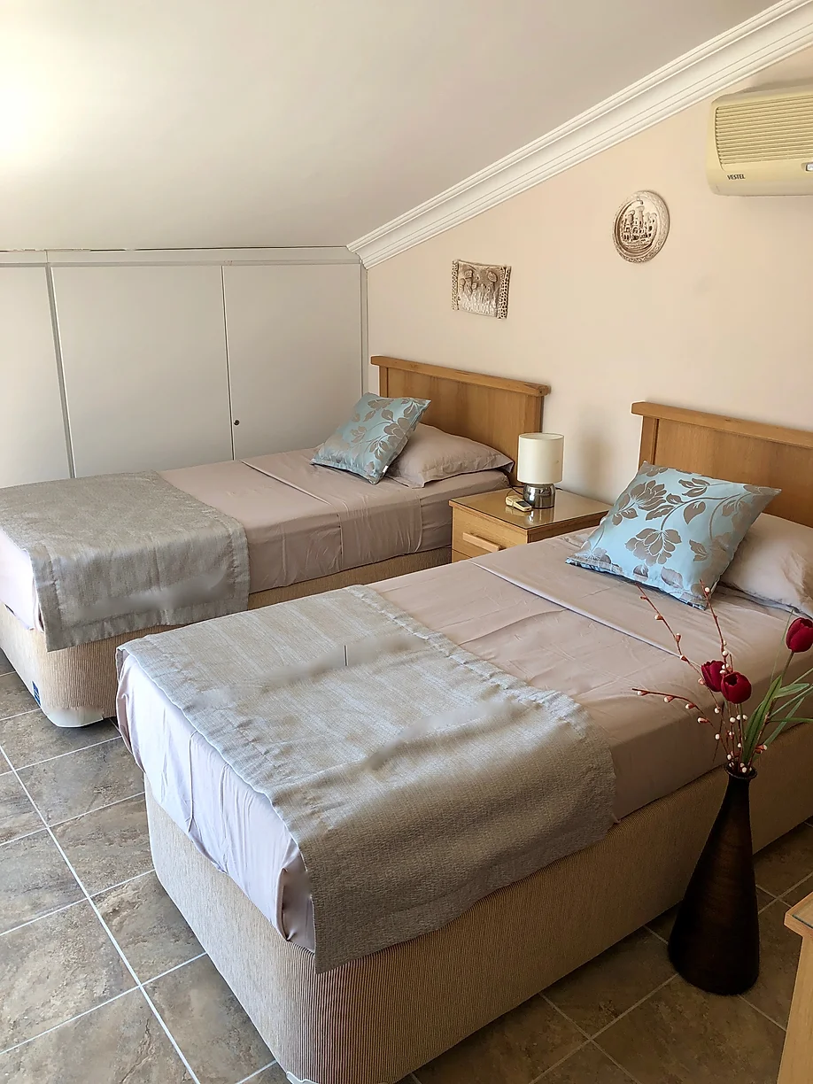 Twin bedroom in Villa Kirmizi Lale, holiday villas in Kalkan, Turkey
