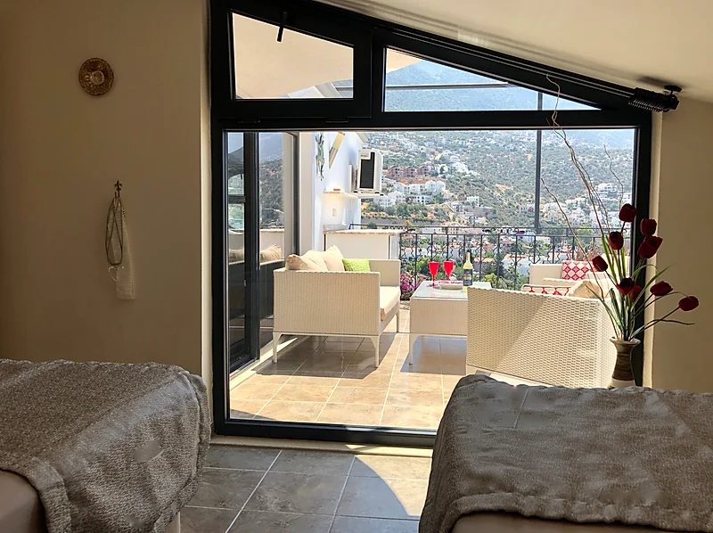 Twin bedroom with balcony in Villa Kirmizi Lale, holiday villas in Kalkan, Turkey