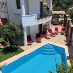Birdseye view of outdoor pool in Villa Kirmizi Lale, holiday villas in Kalkan, Turkey