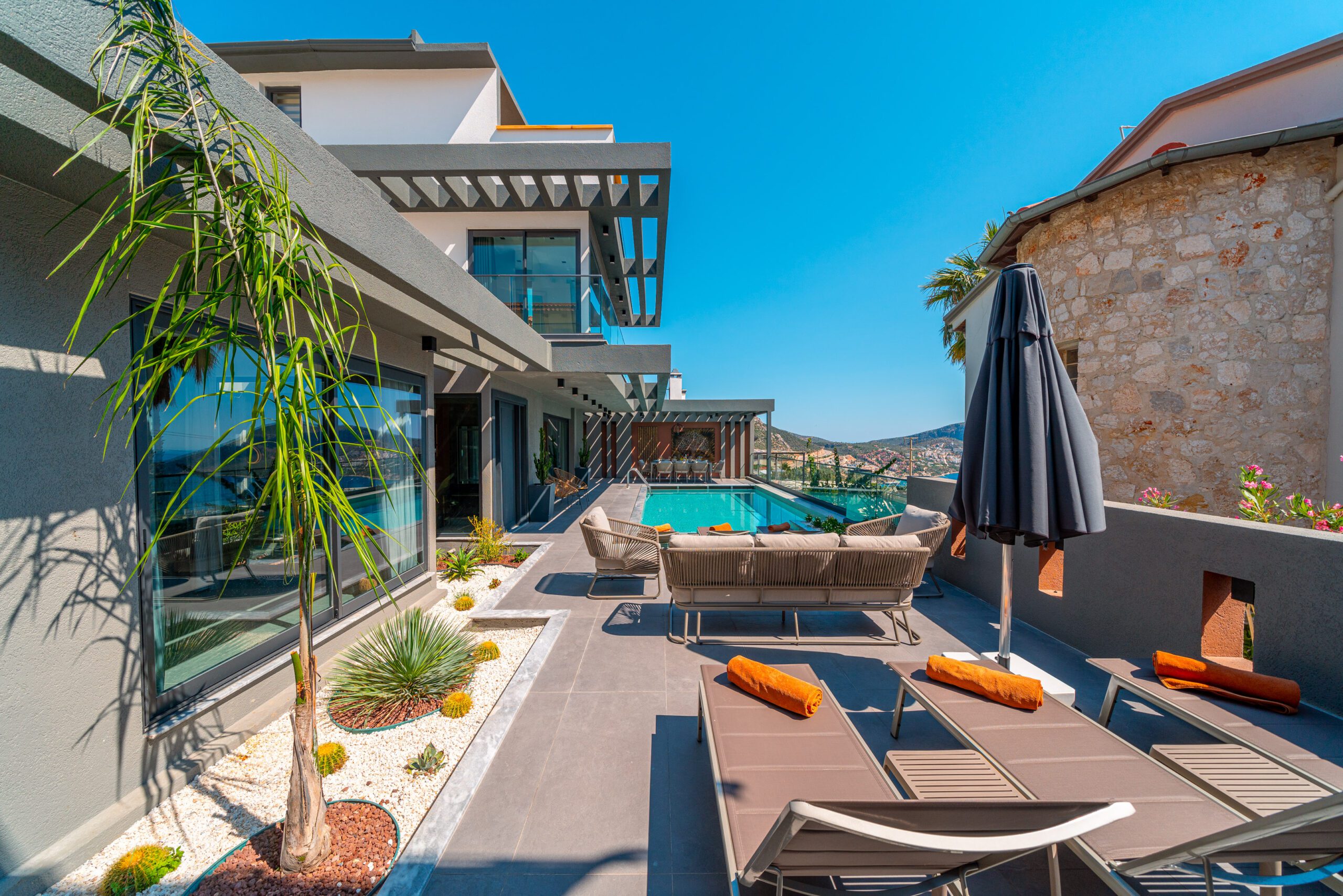 Outdoor pool with sun loungers at Villa Nova, villa holidays in Kalkan, Turkey