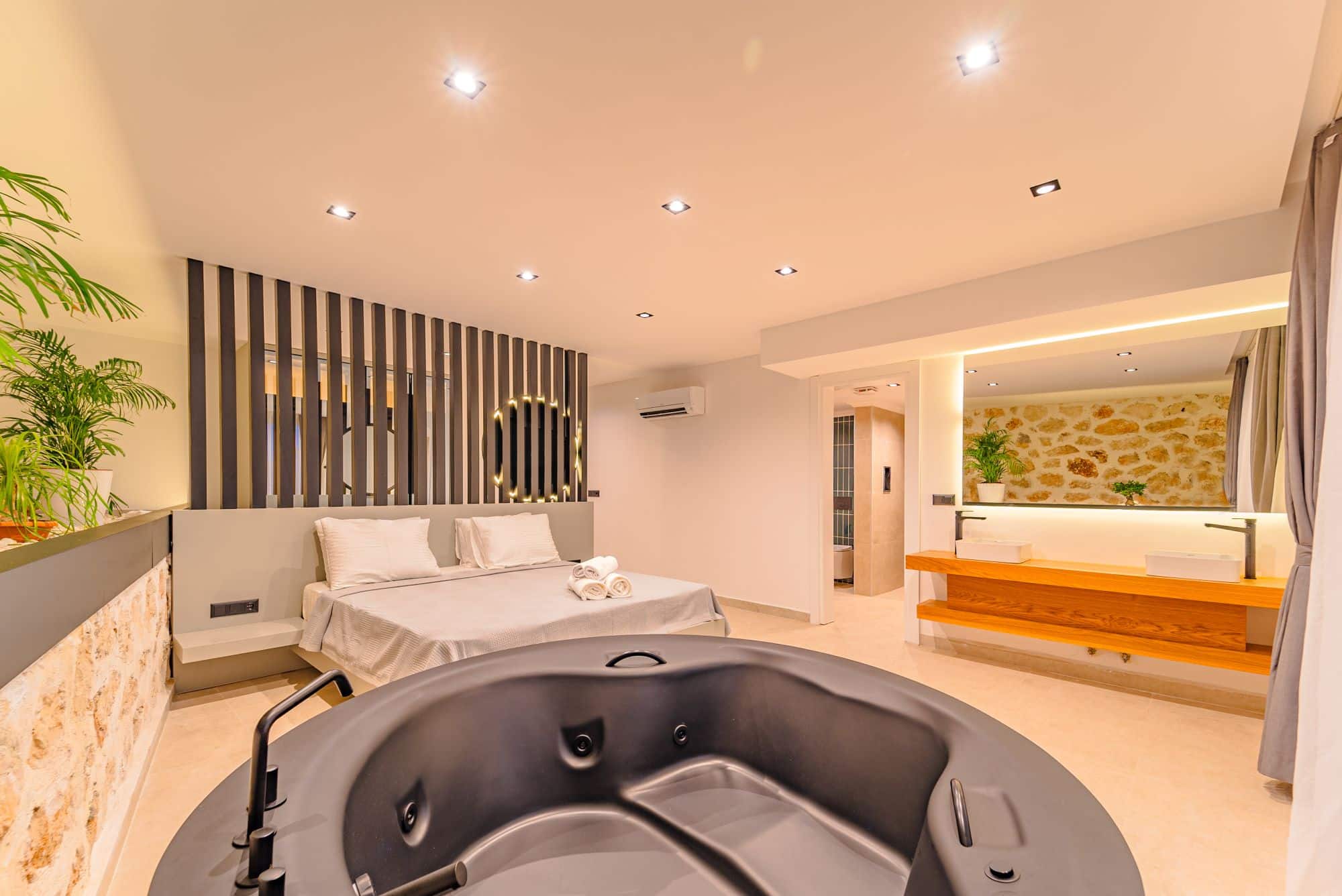 Spacious double bedroom and bathroom in Villa Nobles Rox, villa holidays in Kalkan, Turkey