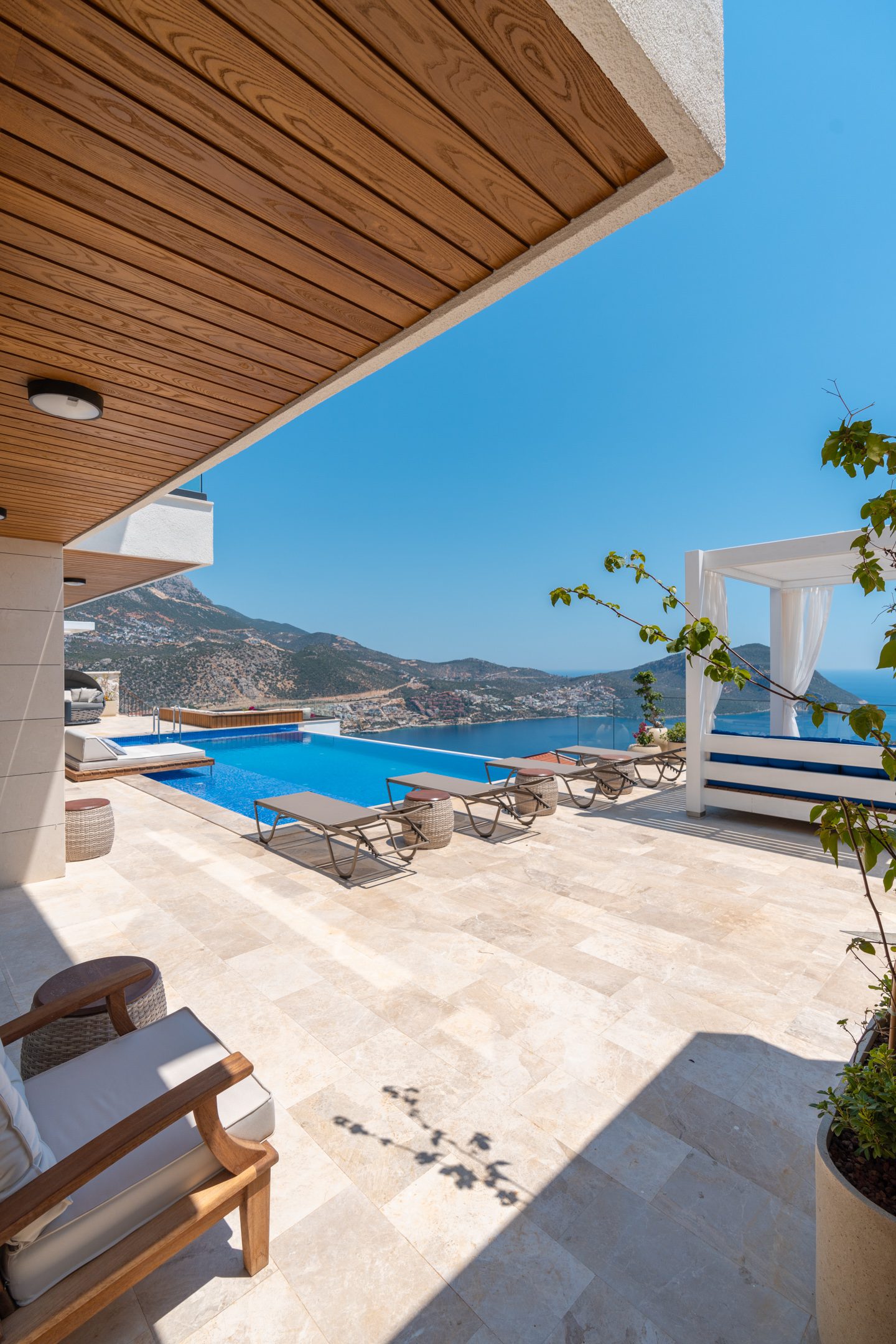 Outdoor infinity pool and sun loungers at Villa Anatolia 3, villas to rent in Kalkan, Turkey